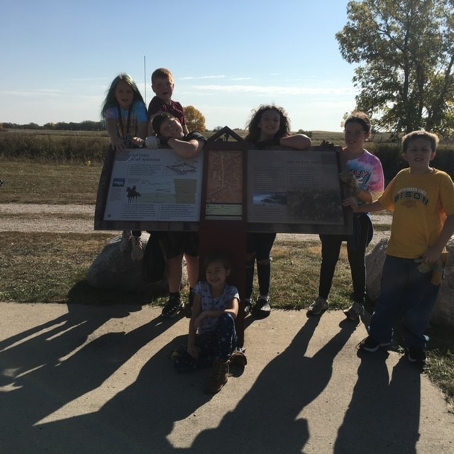 Students posing by the Fort Ransom historical site.