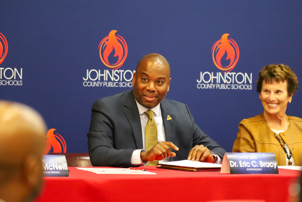 Superintendent Dr. Eric Bracy (left) and Johnston County Board of Education Chair Lyn Andrews (right) present the academic success at the press conference.