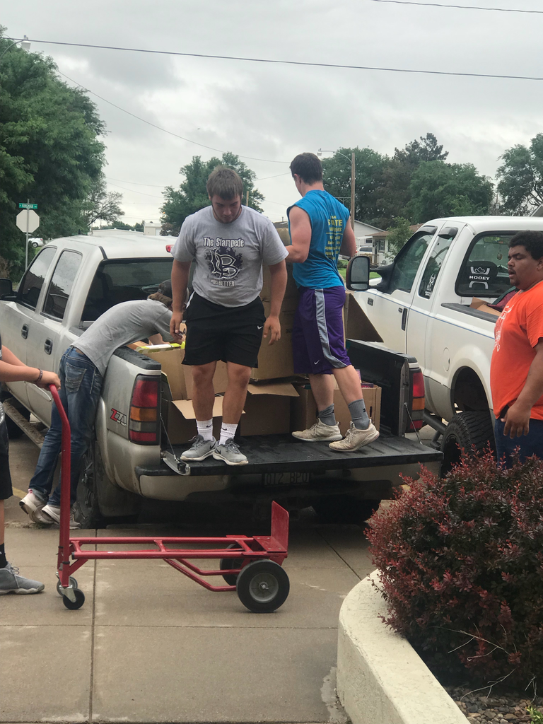 boys loading truck