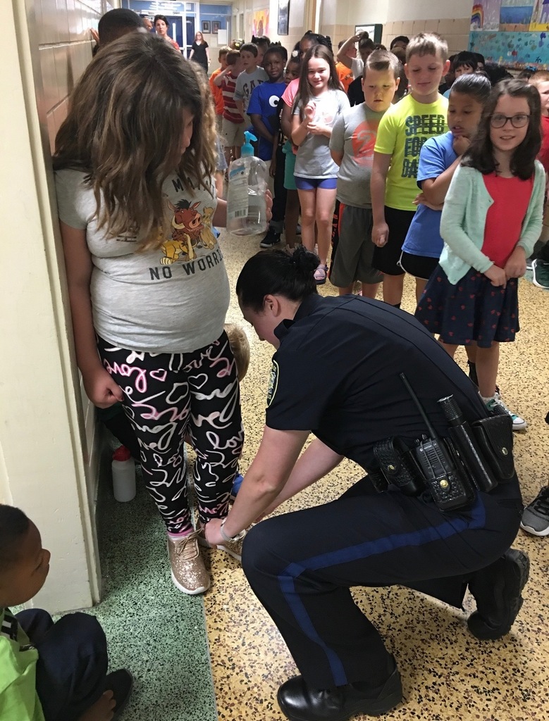 Officer Benton helping out a student!