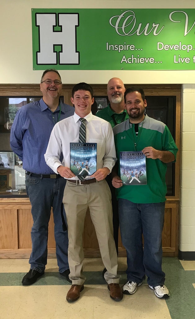 Pictured: Elijah McCloskey, Athletic Director Justin Kellough, Publisher Chris Scott and HS Principal Craig Kerns.