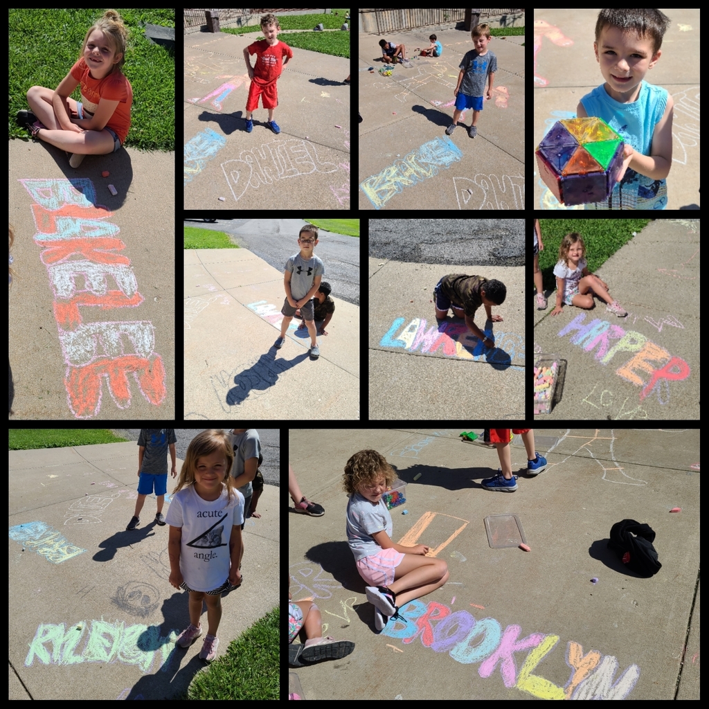 K-1 students coloring their names with sidewalk chalk. 