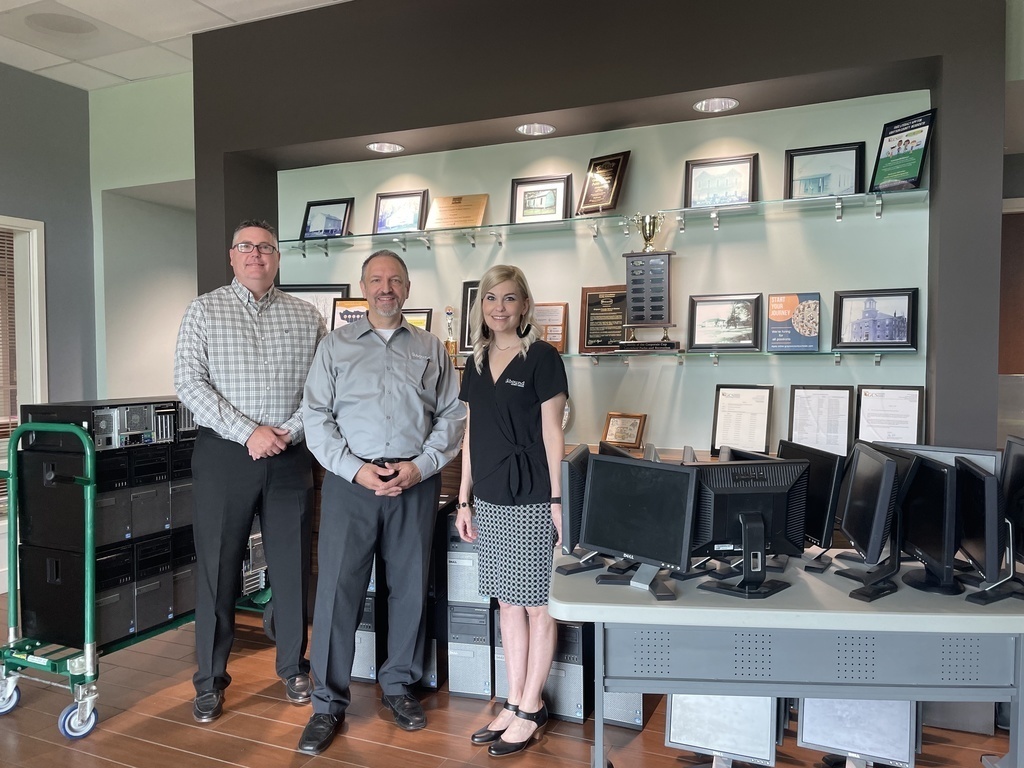 Doug Robinson, Dave Evangelista and heidi Baldwin with donated pcs and monitors