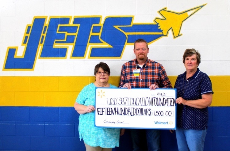 people hold large check