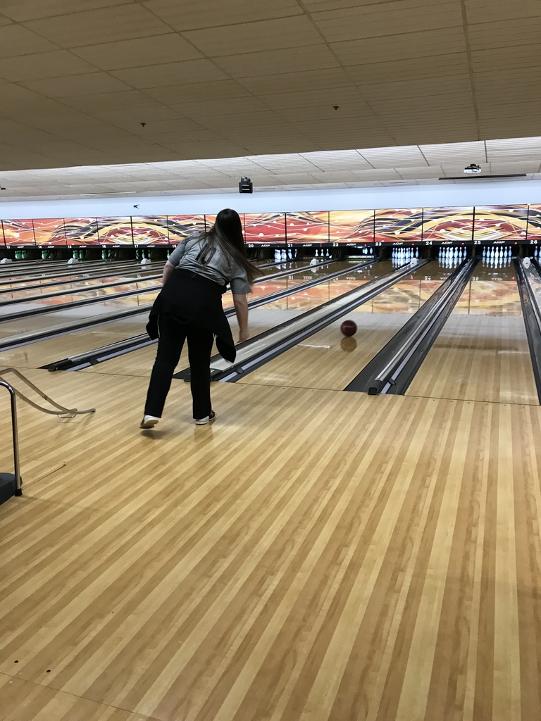 Bella knocking pins out in bowling.