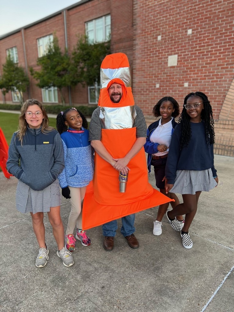 Mr. Lester dresses as a traffic cone to celebrate with 6th grade students for meeting their growth goal.