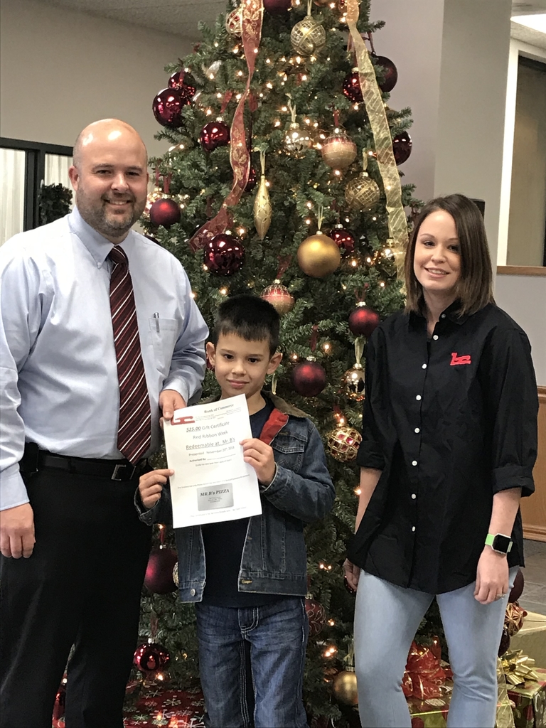 Mason accepting his Mr. B’s gift card from the Bank of Commerce.