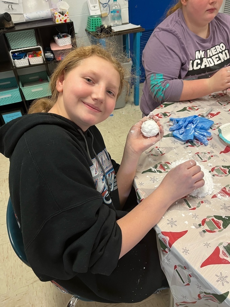 student poses with fake snowball