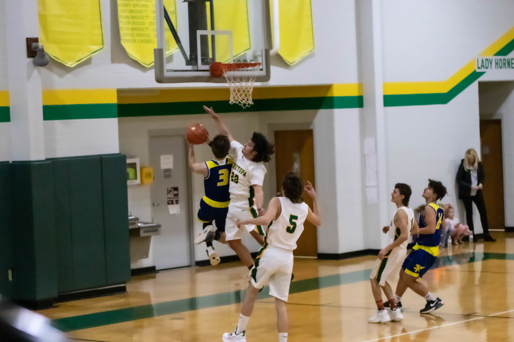 AMHS boys player goes in for layup