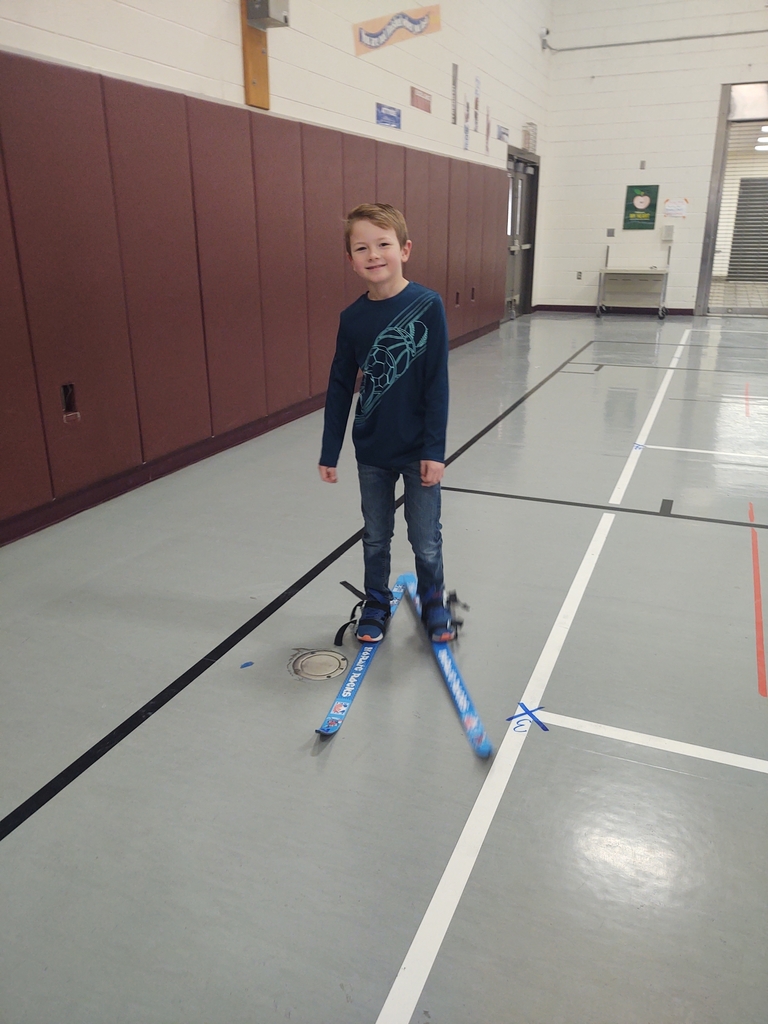 We got the skis out and practiced pulling them on, getting up, turning, and moving inside today.