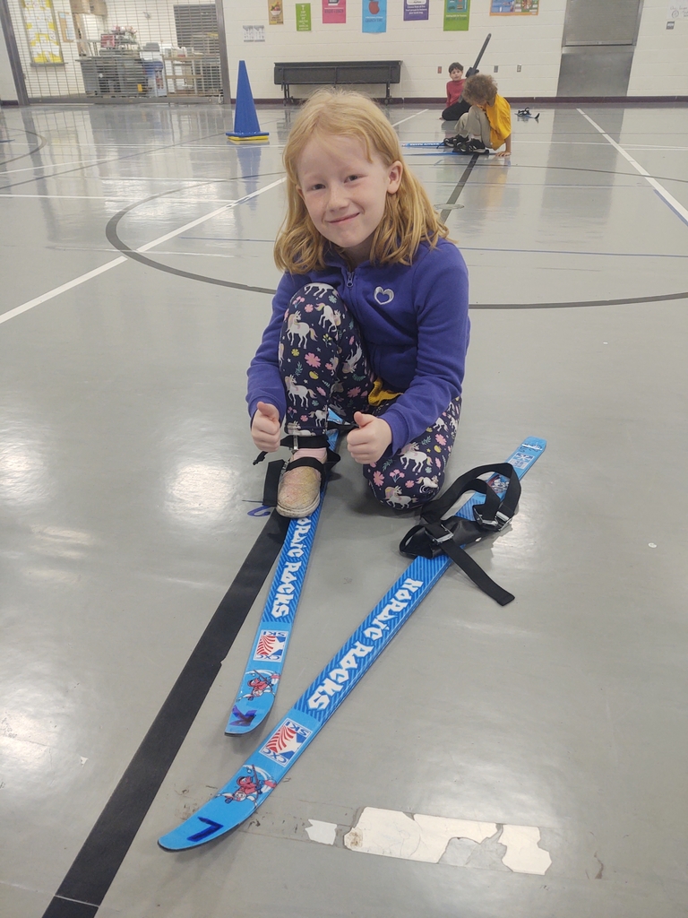 We got the skis out and practiced pulling them on, getting up, turning, and moving inside today.