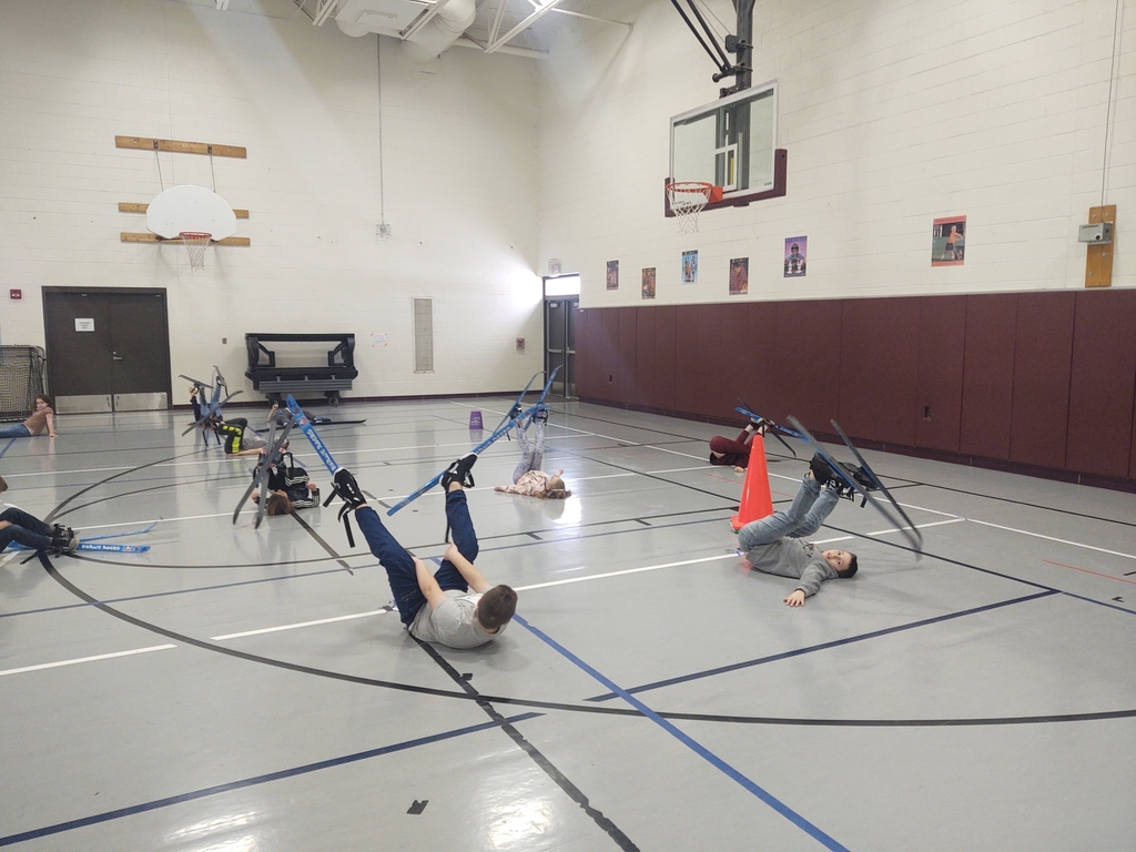 We got the skis out and practiced pulling them on, getting up, turning, and moving inside today.