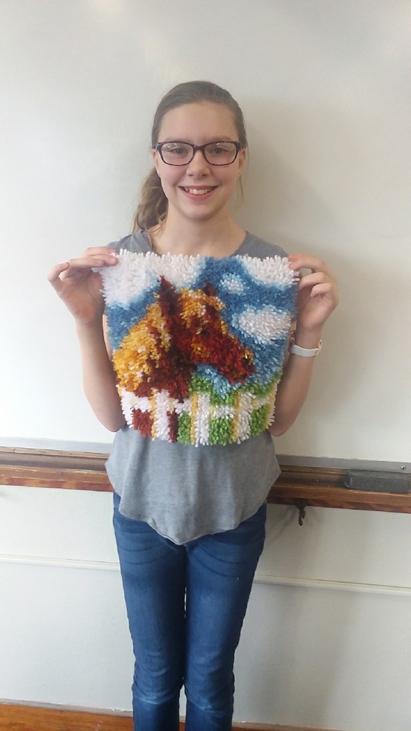 Evelyn and her latch hook project!