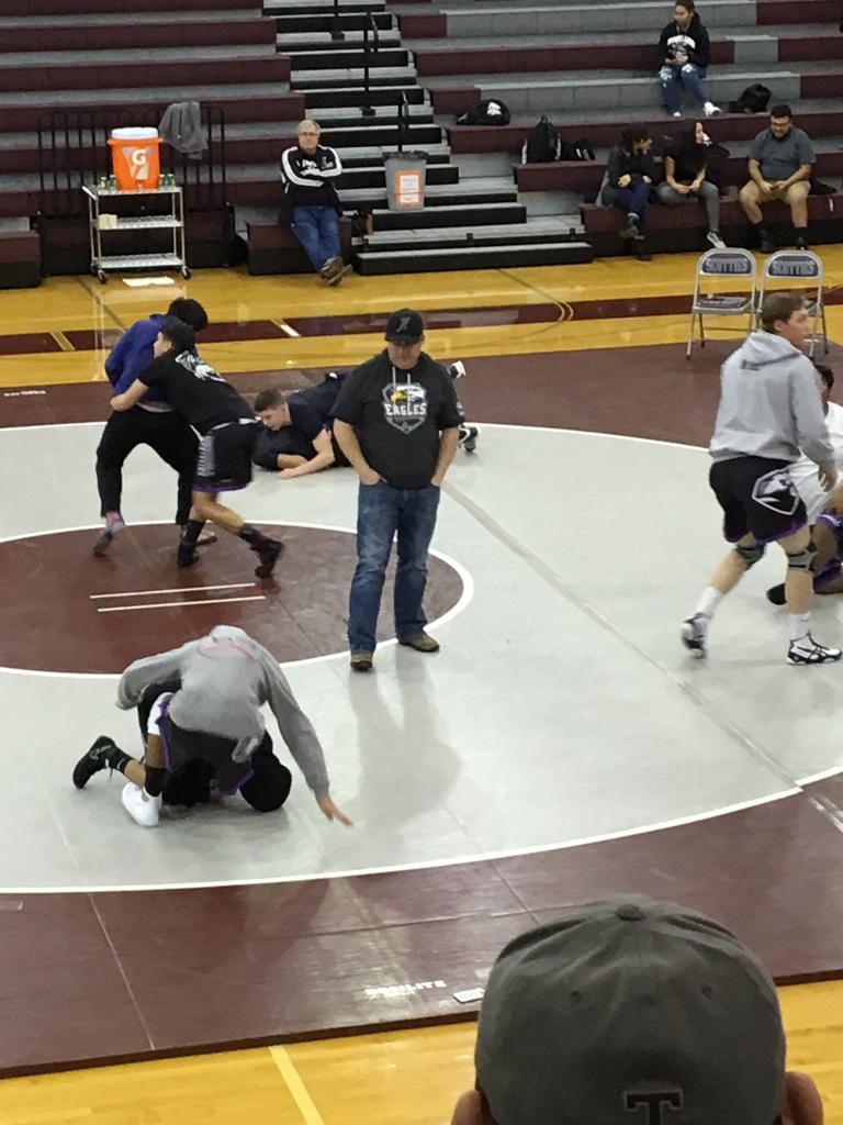 Coach supervising warm ups