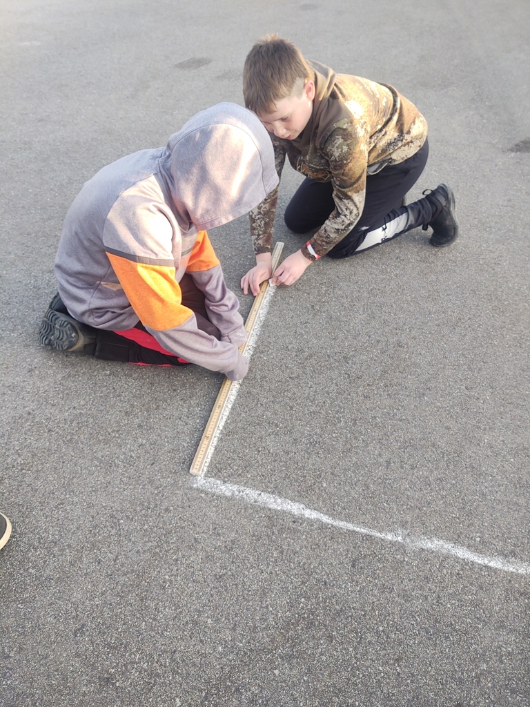 A little math in PE today as students measured and made our four square courts.