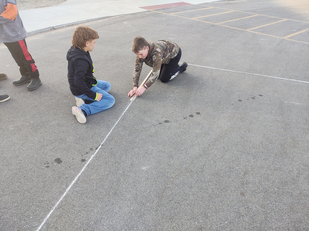 A little math in PE today as students measured and made our four square courts.