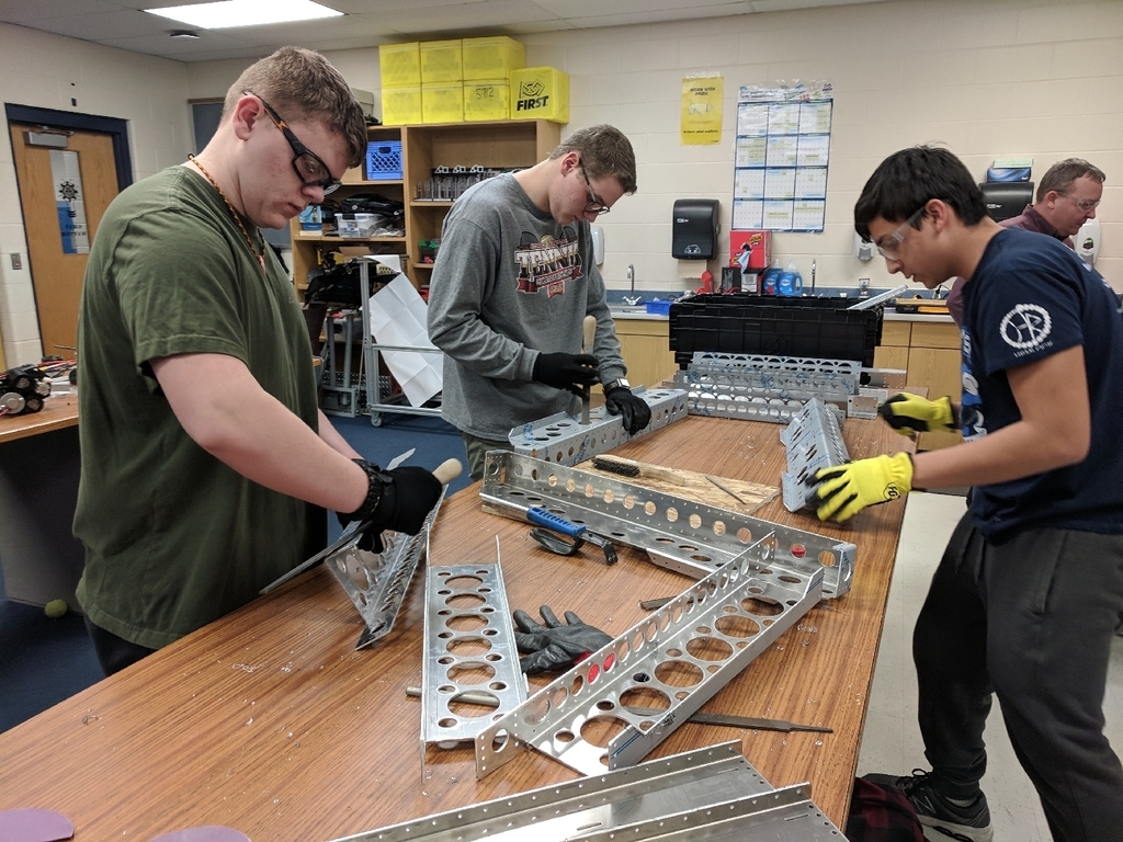 Students build robot chassis.