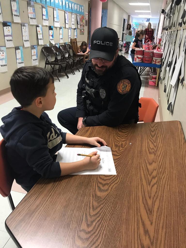 Officer Collins helping student