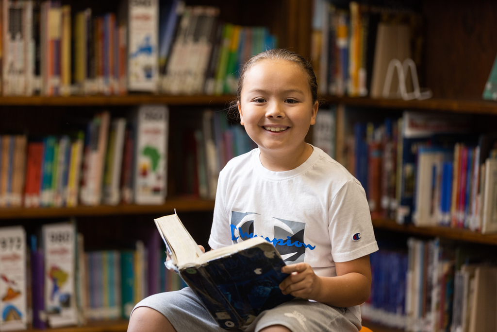 UPK Student reading book