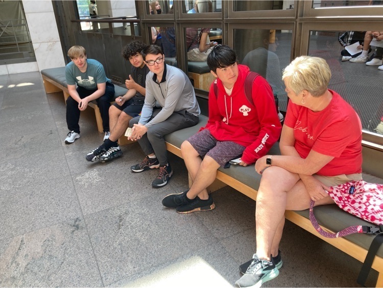 Students discuss their Holocaust Museum experience with Mrs. E