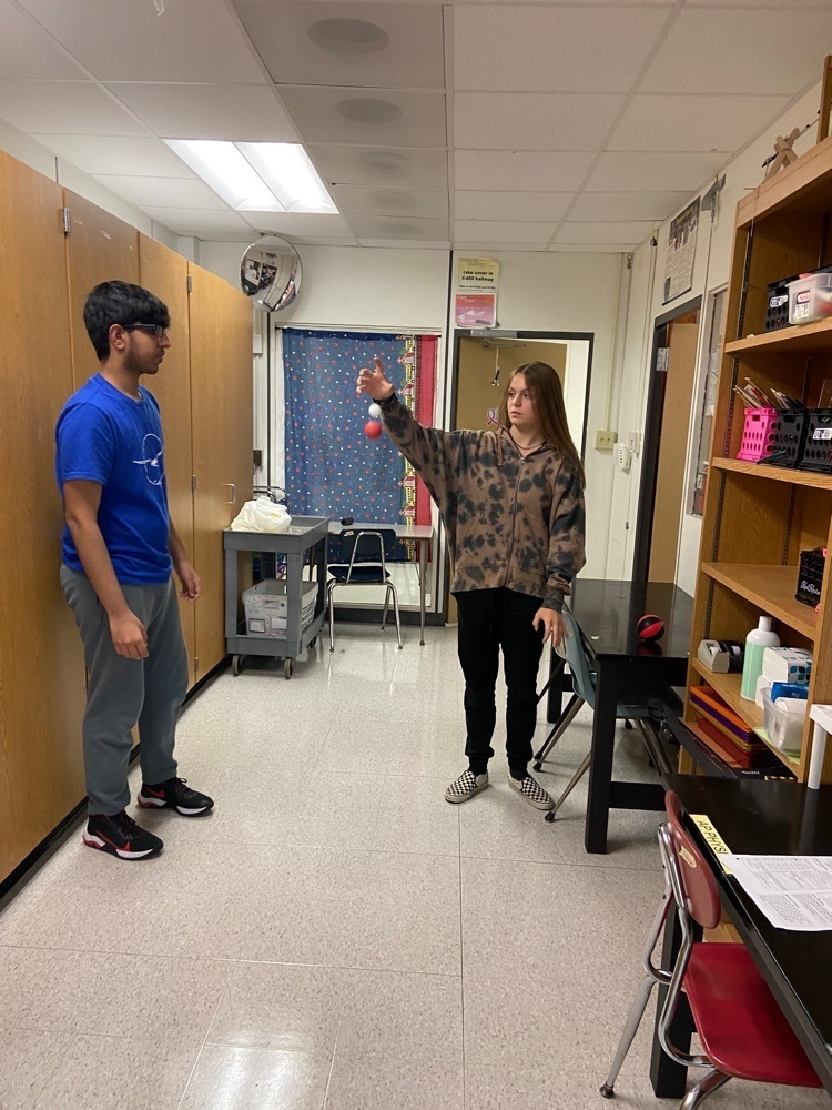 AP Physics students trying to determine bounce height.