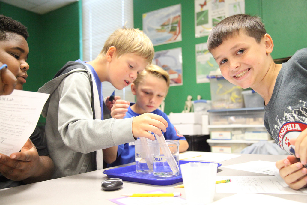 Students measuring temperature of water