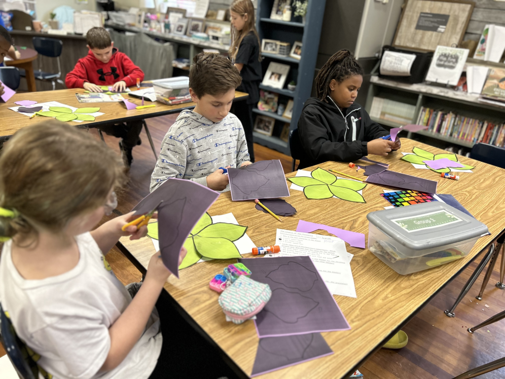 students cutting paper