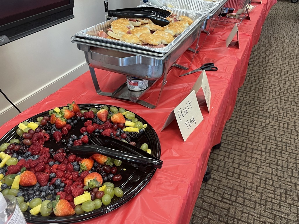 fruit tray and biscuits on buffet table