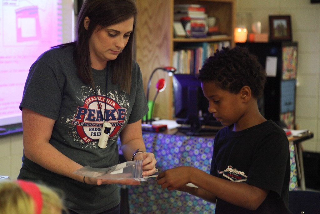 Ms. Clark helping student