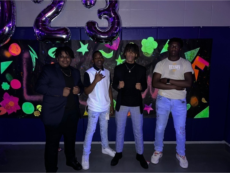 Students pose before entering the dance