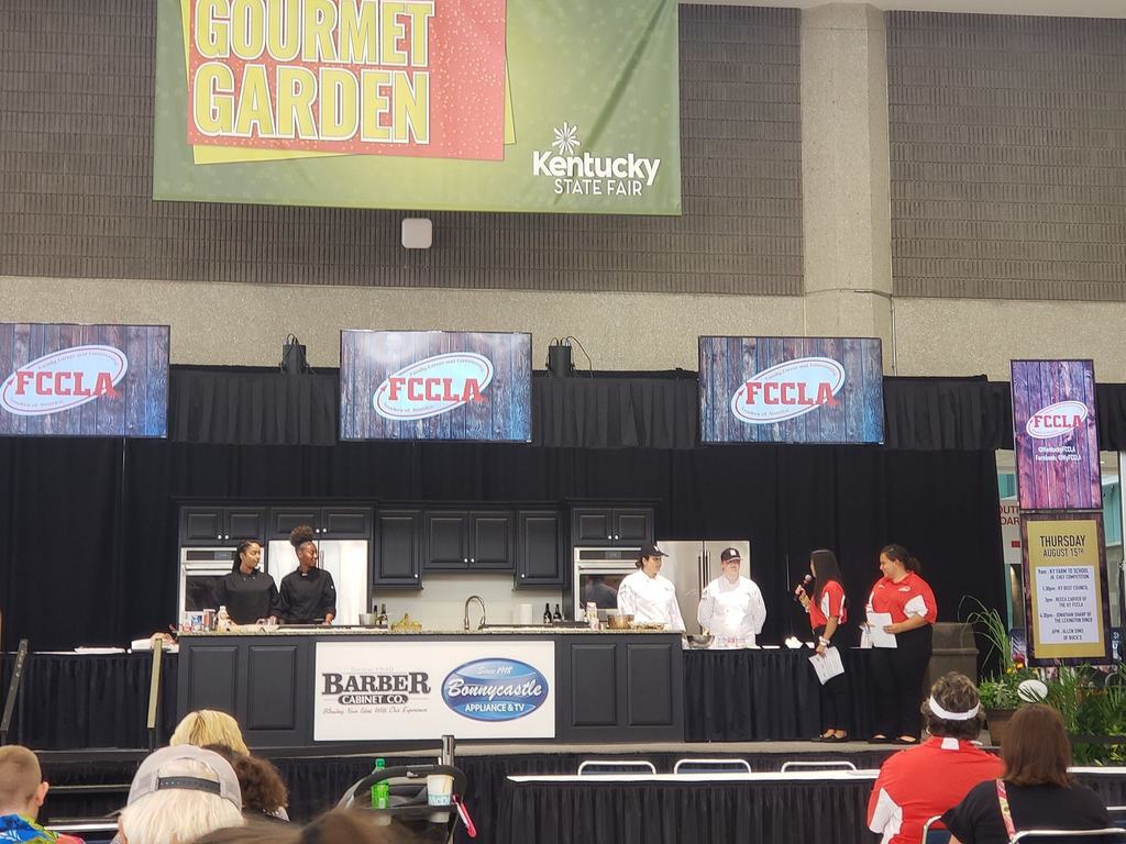 people on stage with culinary equipment FCCLA