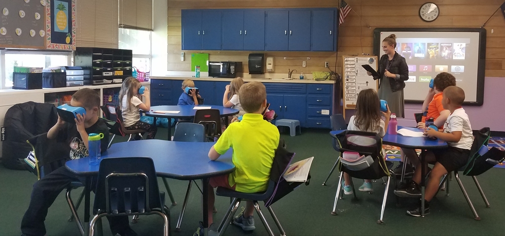 1st grade learning about Antartica with virtual reality goggles.