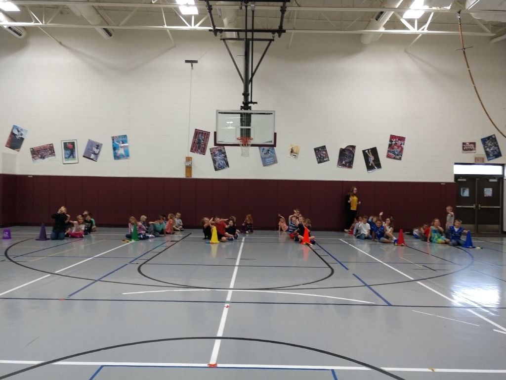 3rd graders and 1st graders worked together today in PE to learn about relays and healthy food.