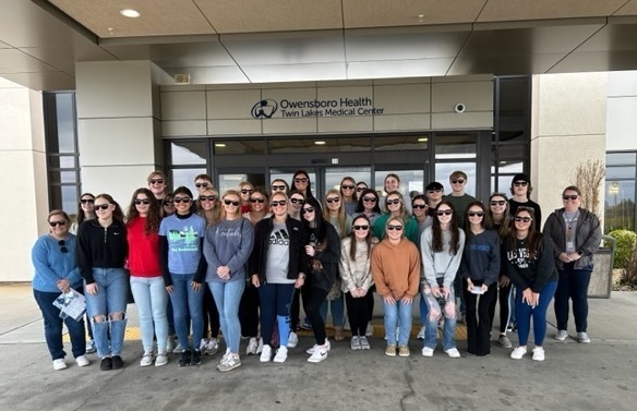 GCHS Health Science student pose in a group in front of Owensboro Health Twin Lakes entrance