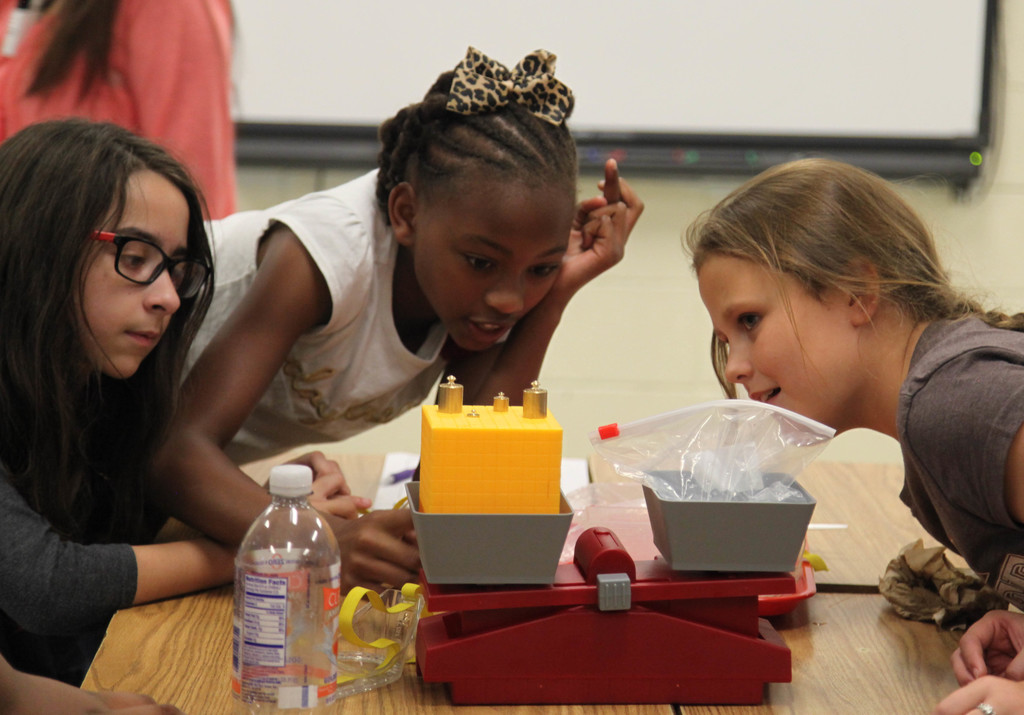 Students performing science experiment