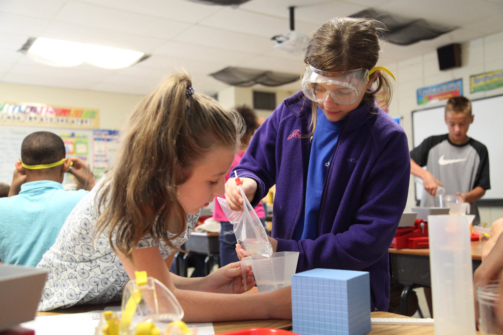 Students performing science experiment