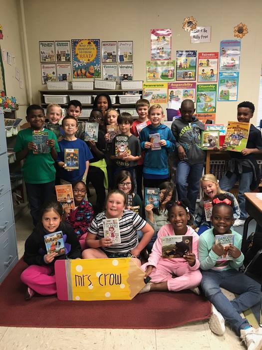 Ms. Crows class holding books