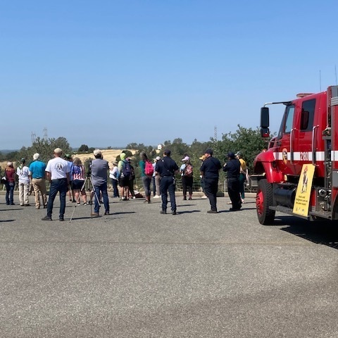 fire truck and crowd watching grazing demonstration 