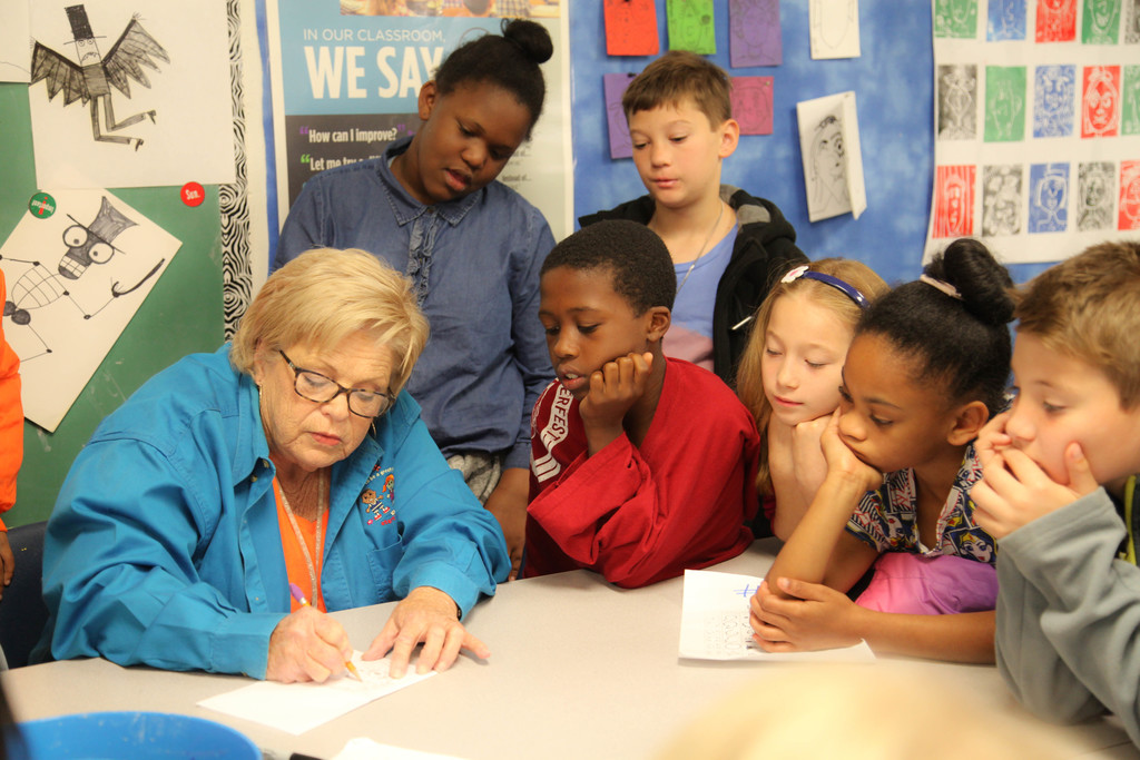 Students working on picasso faces in art