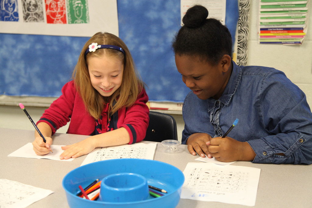 Students working on picasso faces in art