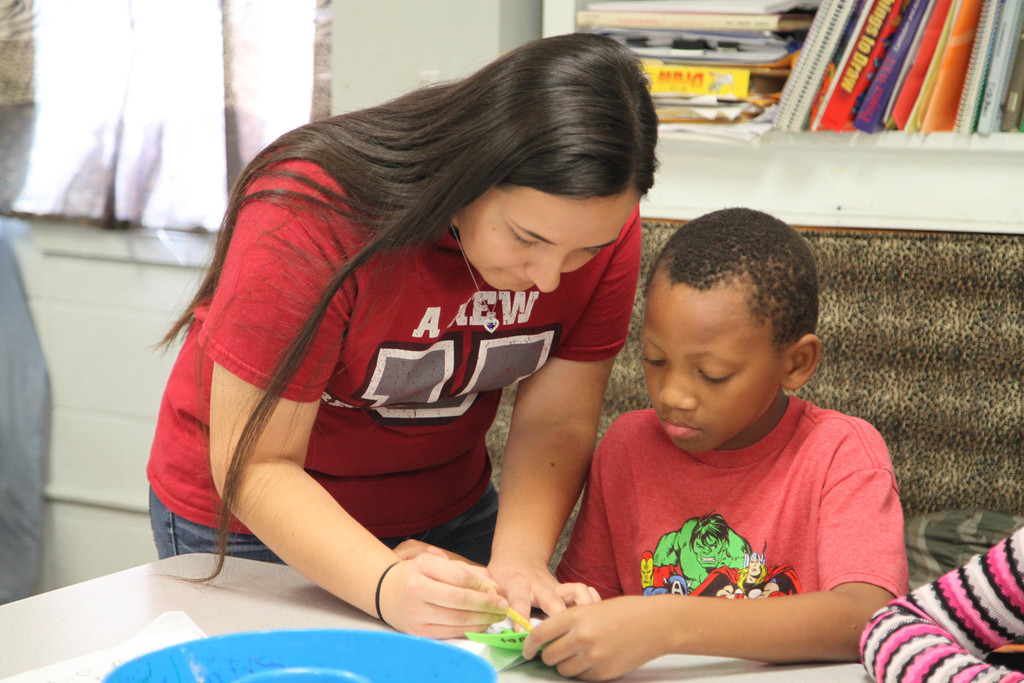Students working on picasso faces in art