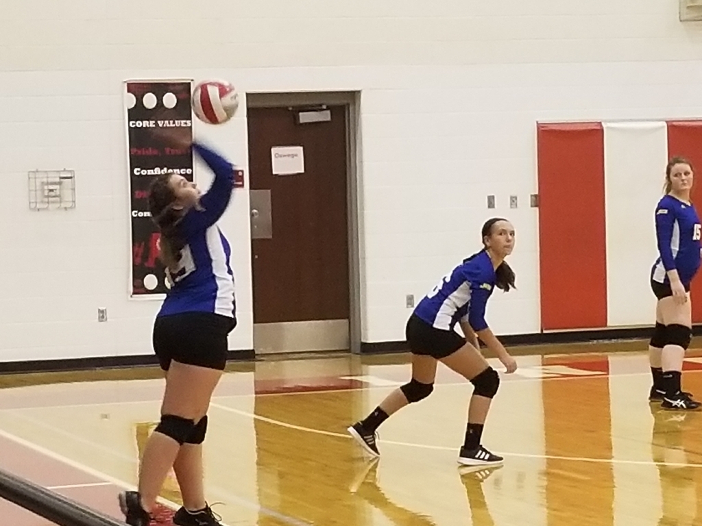 Emma Martin serves for the Lady Jets