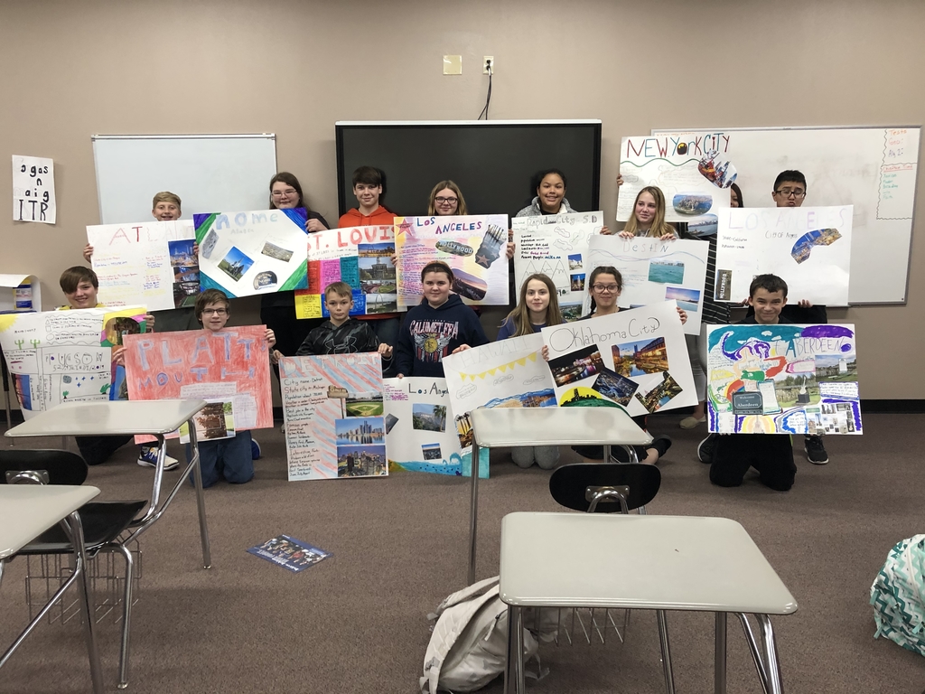 7th grade city poster presentations in Foster’s room.