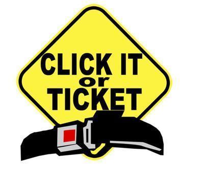 Yellow warning sign with "Click it or Ticket" seatbelt over the lower portion of sigh