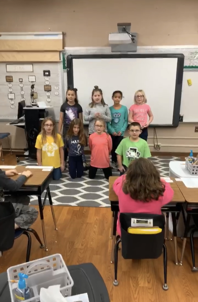 Kids presenting a song they wrote themselves