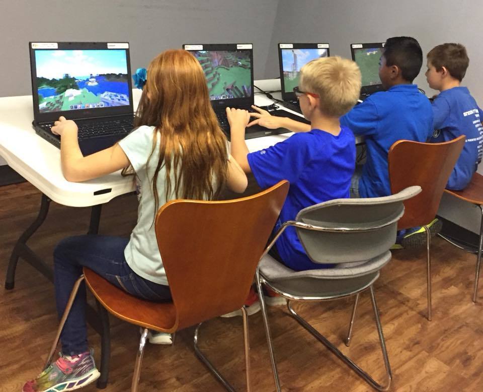 Students playing games on computers