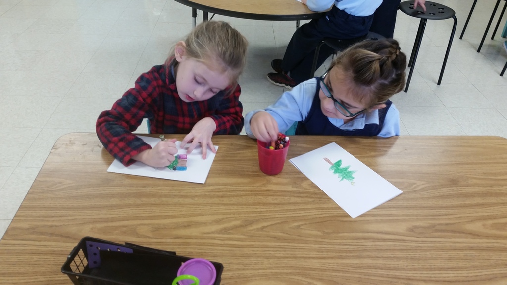 Kindergarten and first grade made blessing bags for the homeless.