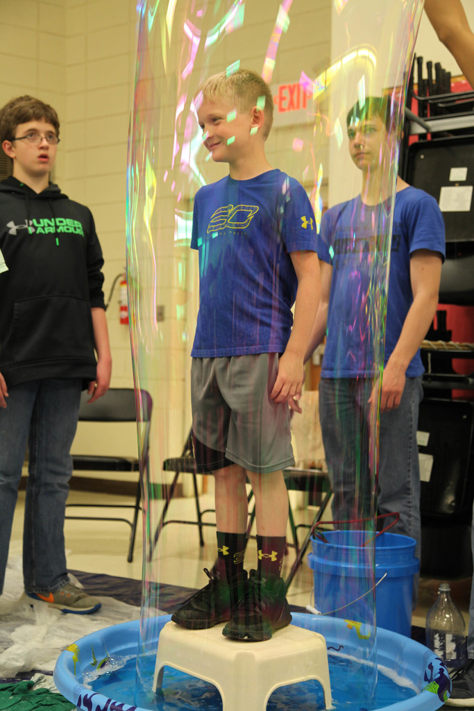 student standing in a bubble