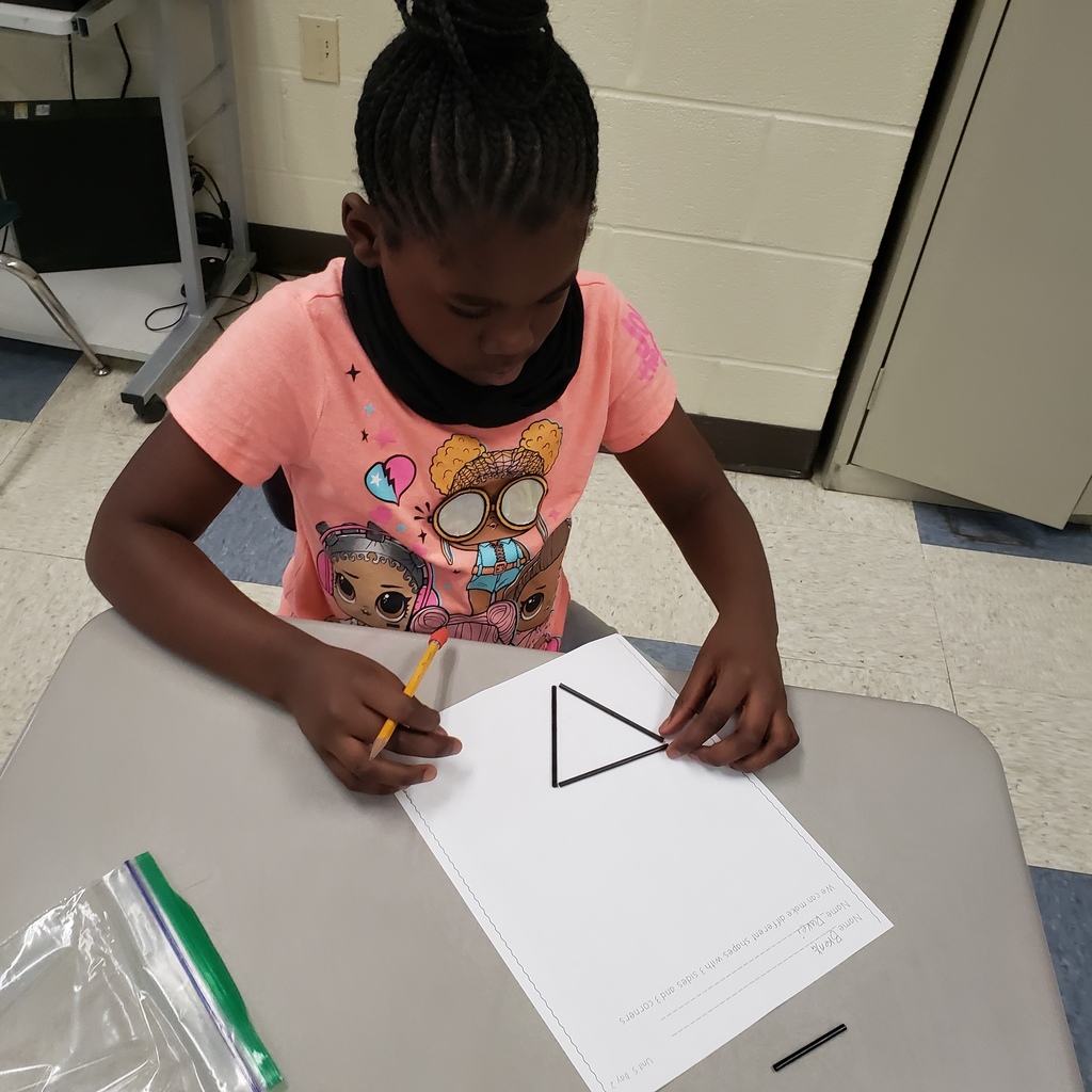 Students creating 3 sided shapes